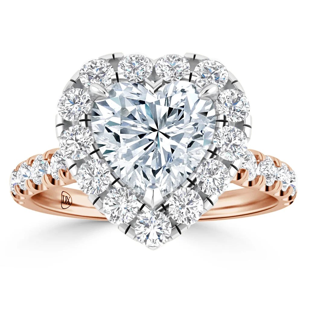 Heart-shaped diamond ring with a halo of smaller diamonds and a rose gold band set with diamonds.