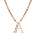 Rose gold necklace with an “A” pendant, featuring a line of small, sparkling white gemstones on one side.