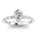 Pear-shaped diamond ring with a twisted band set with round diamonds on a white gold or platinum setting.