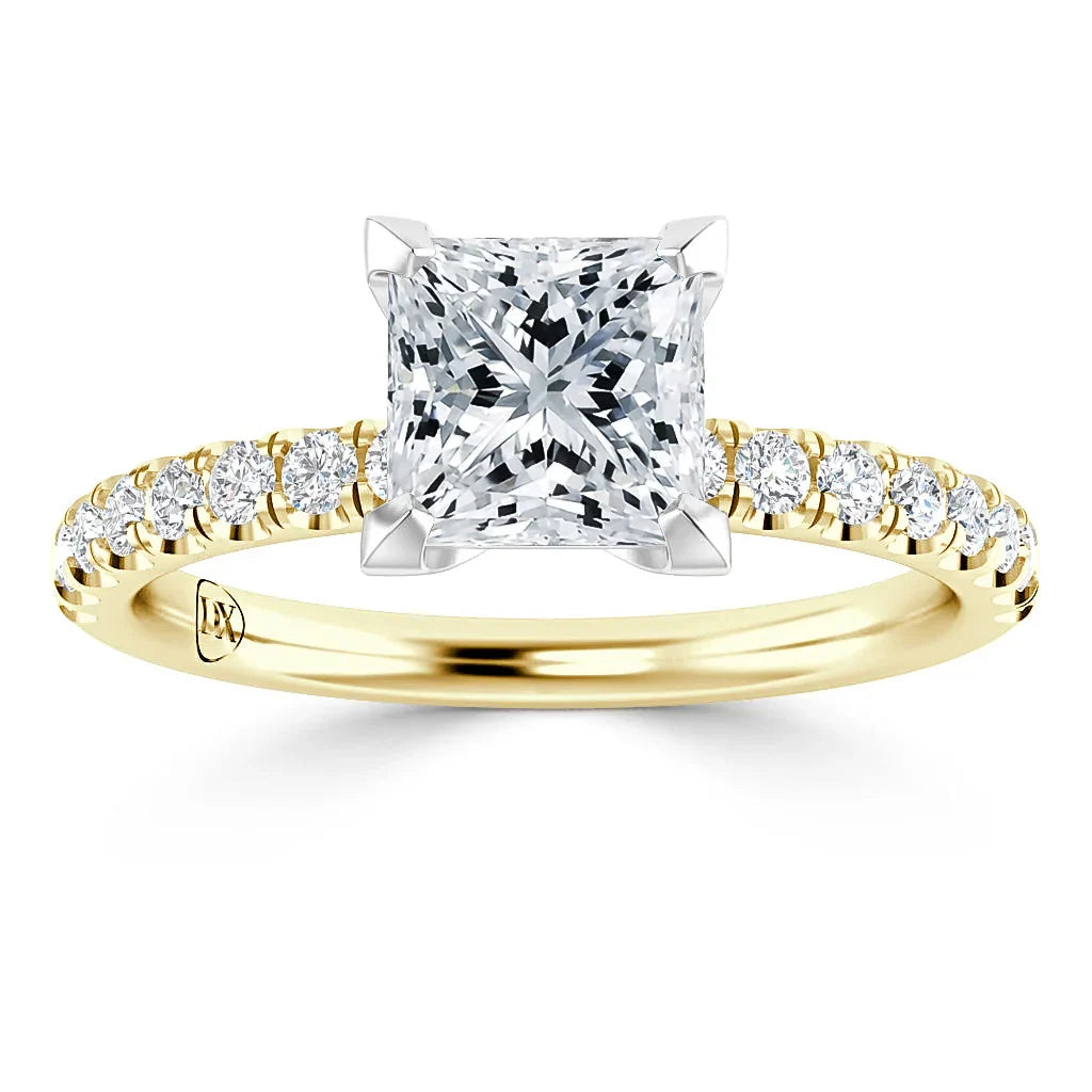 A gold ring with a square-cut diamond center and smaller diamonds along the band, displayed on a white background.