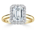 Emerald-cut diamond ring with a diamond halo on a yellow gold band, shown on a white background.