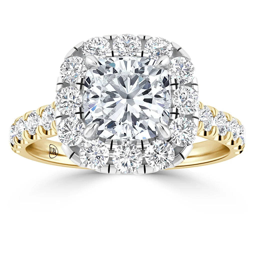 Gold band ring with a large square-cut diamond, surrounded by smaller round diamonds and a diamond-studded band.