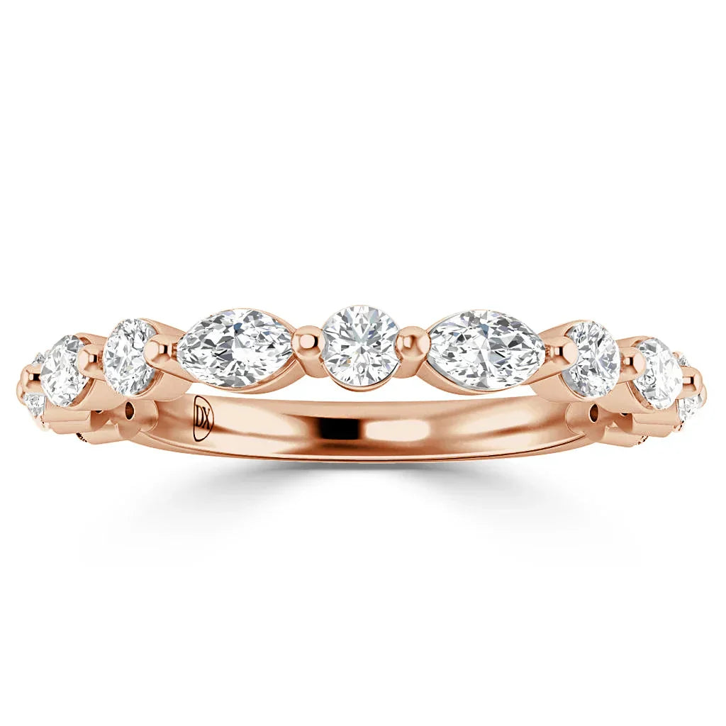 Rose gold ring with alternating round and marquise-cut diamonds set in a delicate, elegant band.