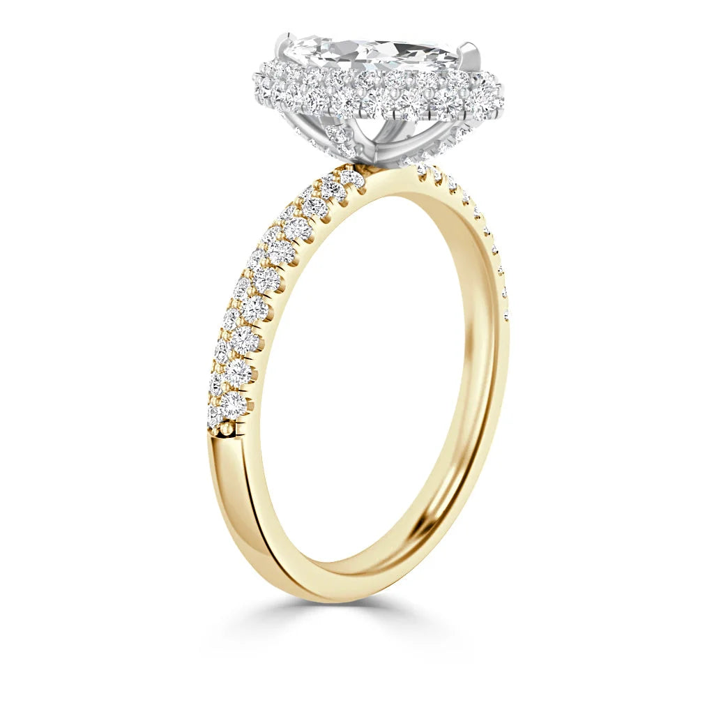 Gold ring with a diamond-studded band and a large oval center diamond surrounded by a diamond halo.