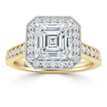 Square-cut diamond ring with a double halo and diamond band set in yellow gold with milgrain detailing.