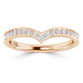 A rose gold chevron ring with a row of small round diamonds set along the V-shaped band.
