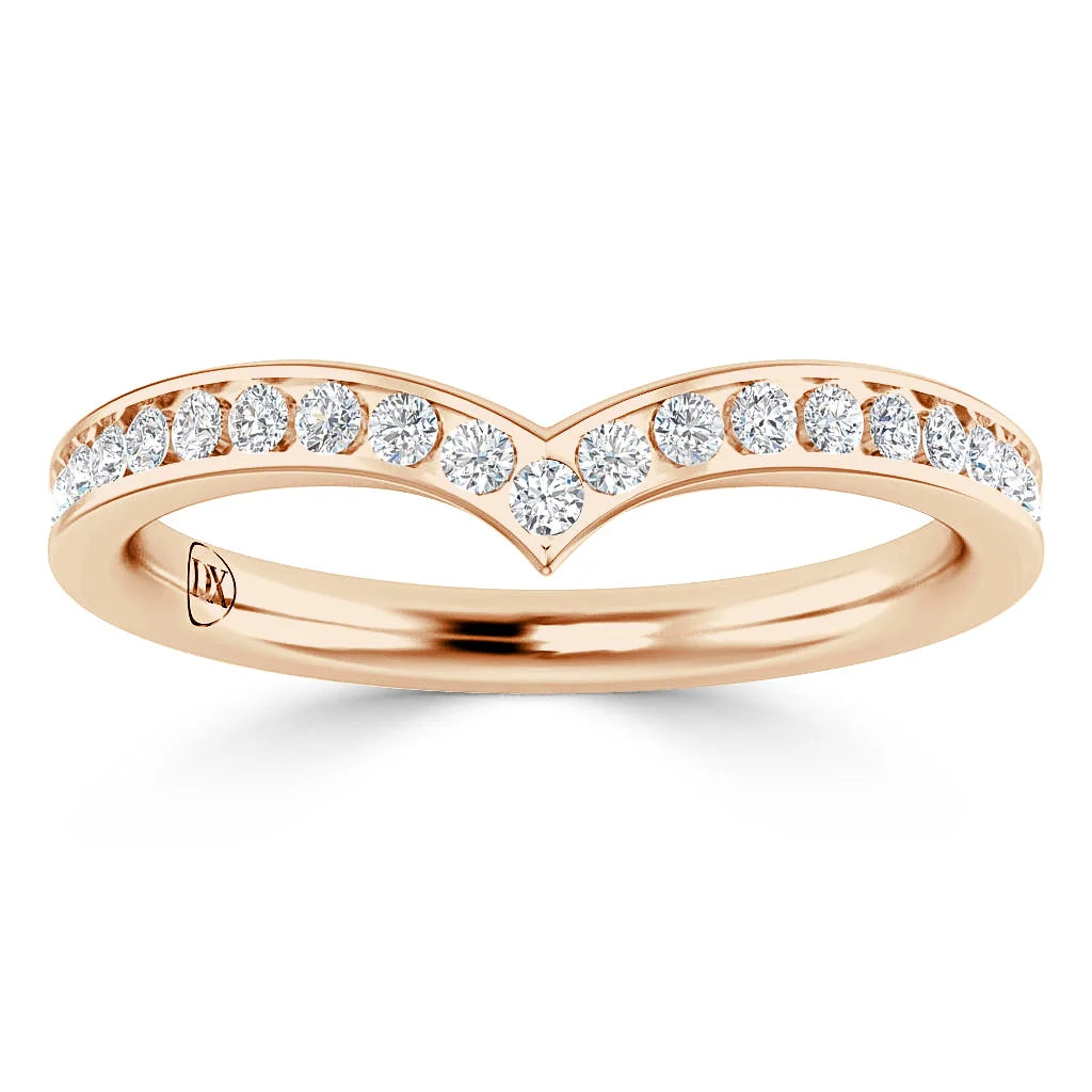 A rose gold chevron ring with a row of small round diamonds set along the V-shaped band.
