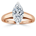 A marquise-cut diamond ring with a rose gold band shown against a white background.