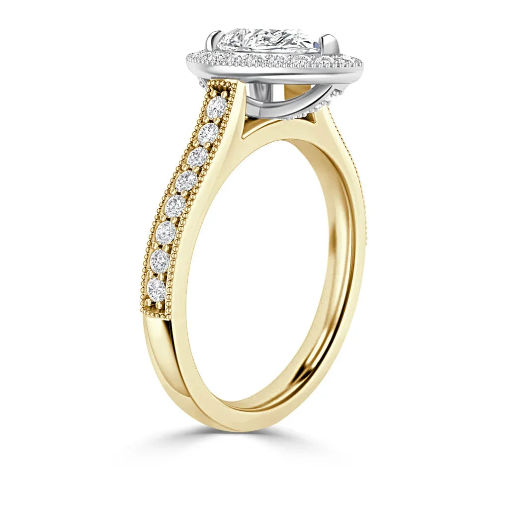 Gold ring with side diamonds set along the band, featuring a large oval diamond in a raised prong setting.