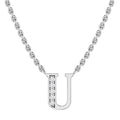 Silver chain necklace with a letter U pendant, half adorned with small sparkling diamonds.
