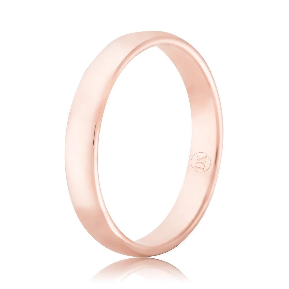A simple, polished rose gold band ring with a subtle engraved logo on the inner side.