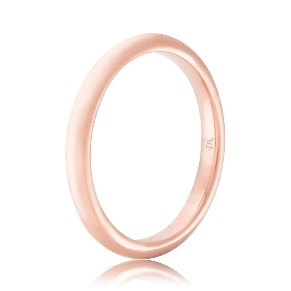 A simple, polished rose gold ring with a smooth surface and a subtle engraved logo on the inner band.