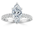 A marquise-cut diamond ring with a diamond-studded band set in white gold or platinum.