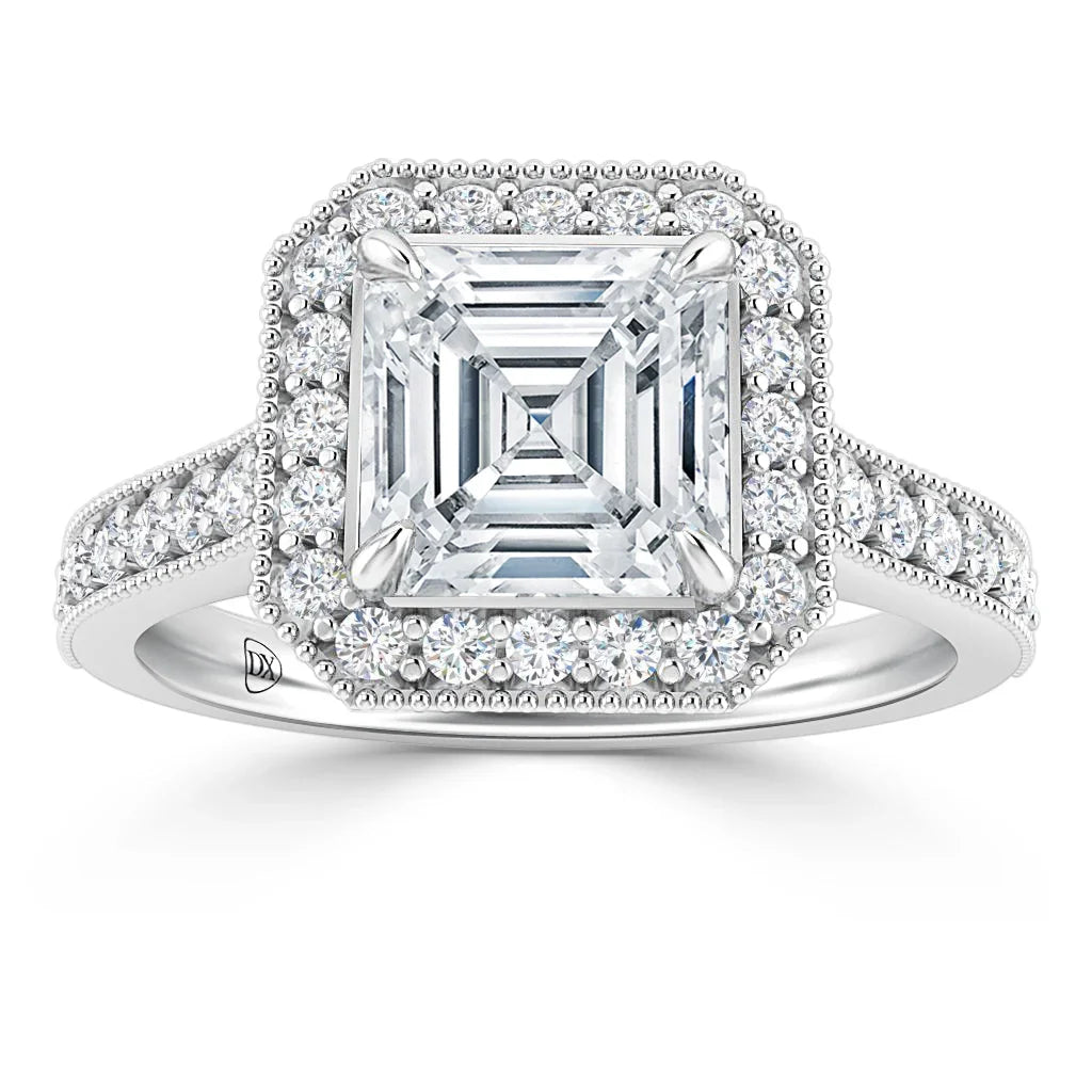 Asscher-cut diamond ring with double halo and pavé diamonds on a white gold band, seen from the front.