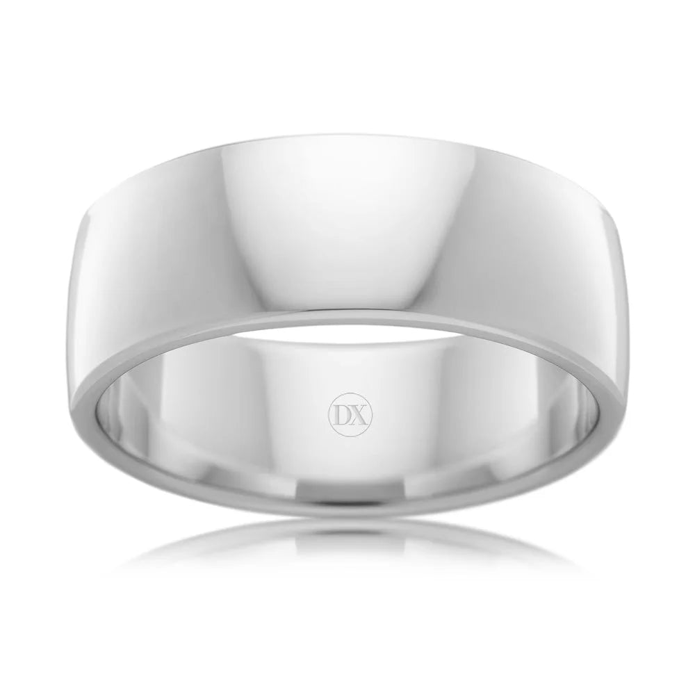 A plain, wide, polished silver ring with a reflective surface and a DX engraving inside.