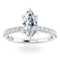 A marquise-cut diamond ring with a pavé band of small diamonds set in white gold.