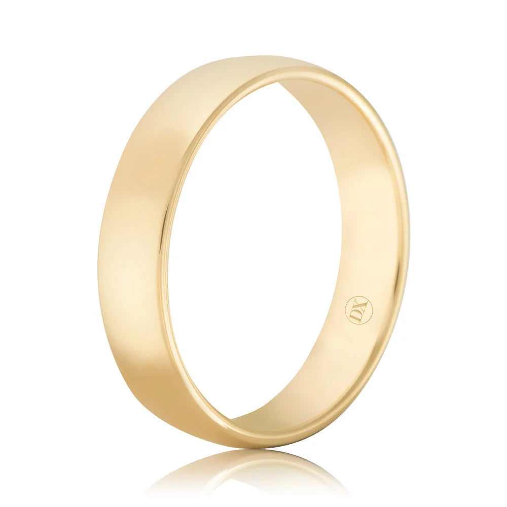 Simple gold band ring with a smooth, polished finish and a small engraved mark on the inner surface.