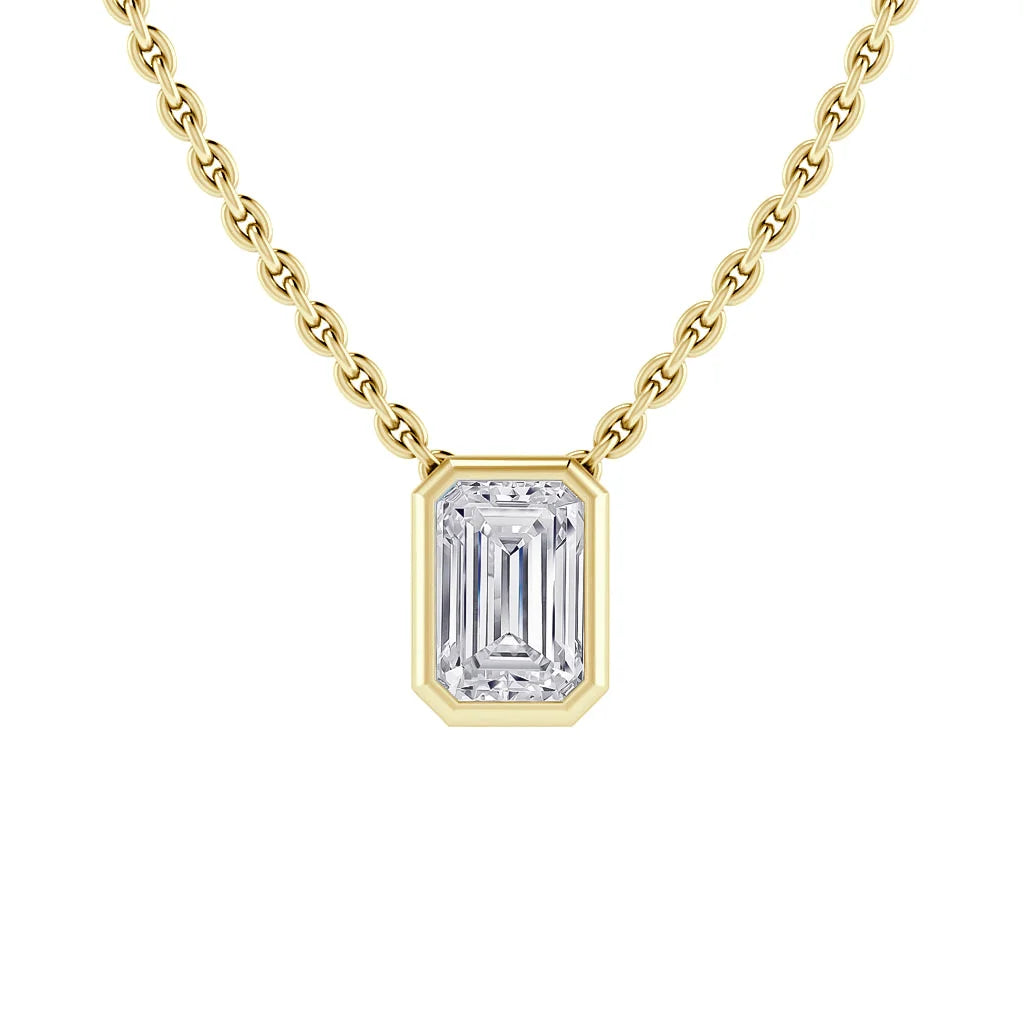 Gold chain necklace with a rectangular emerald-cut diamond pendant in a gold bezel setting.