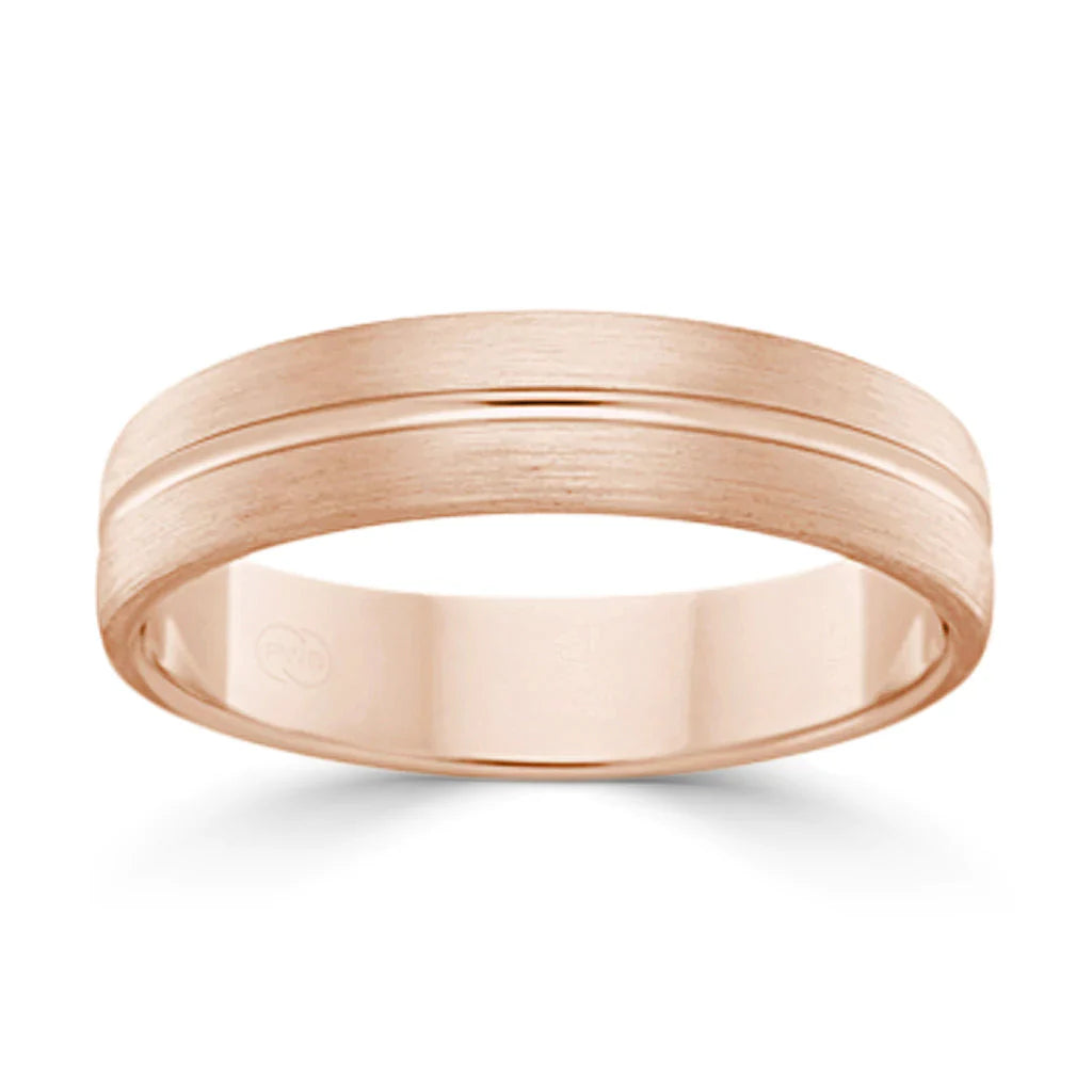 Rose gold wedding band with a brushed finish and a subtle groove around the center.