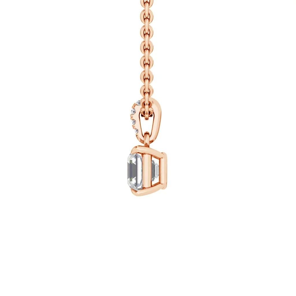 Rose gold chain with a rectangular clear gemstone pendant and small diamonds on the connecting loop.