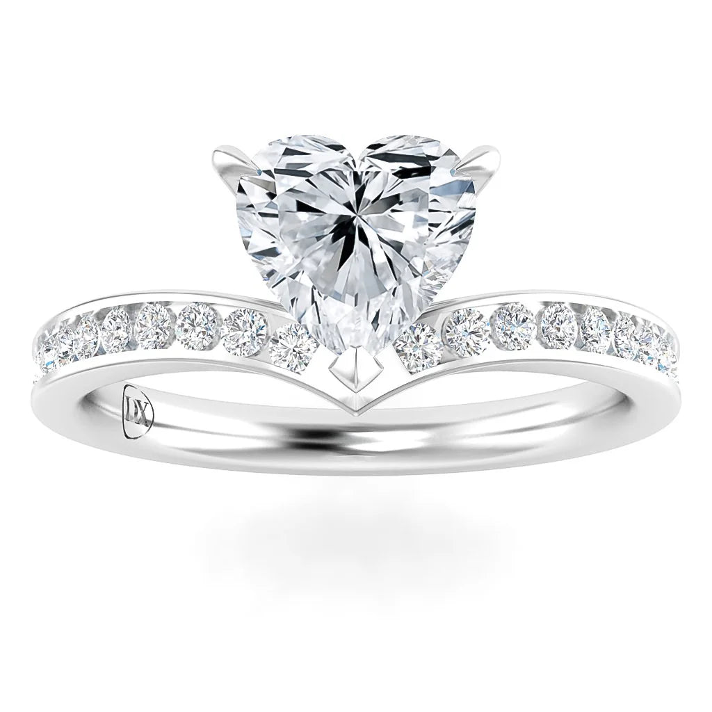 A silver ring with a heart-shaped diamond center and smaller round diamonds on the band.