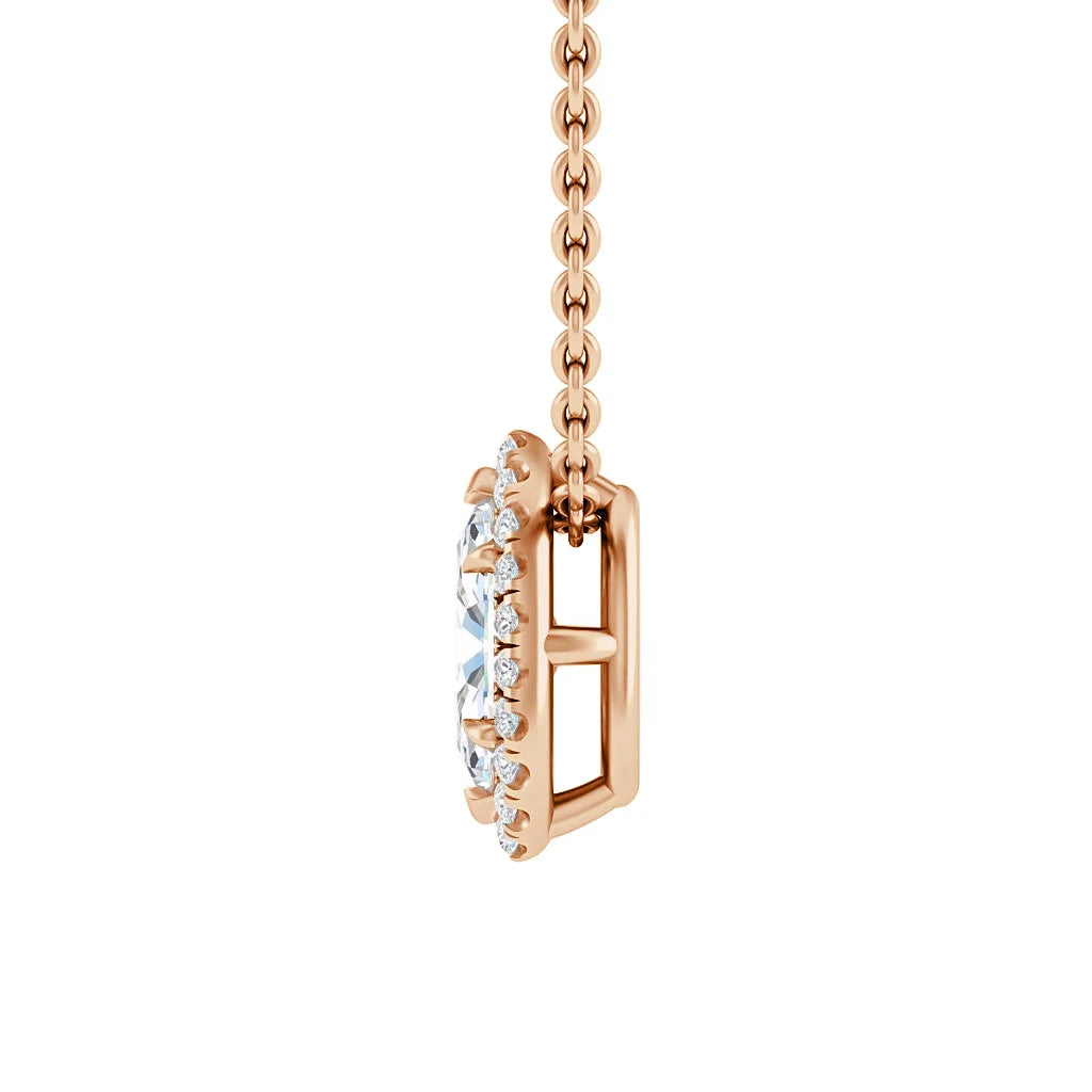 Side view of a rose gold necklace with a round diamond pendant and small diamonds around the edge.