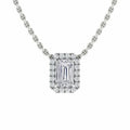A silver chain necklace with a rectangular, emerald-cut diamond pendant surrounded by smaller diamonds.