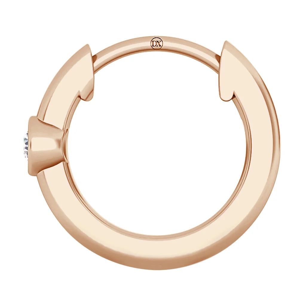 A rose gold circular hoop earring with a small diamond detail on one side, shown against a white background.