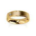 A gold ring with a brushed finish and a single small diamond set into its smooth, flat surface.