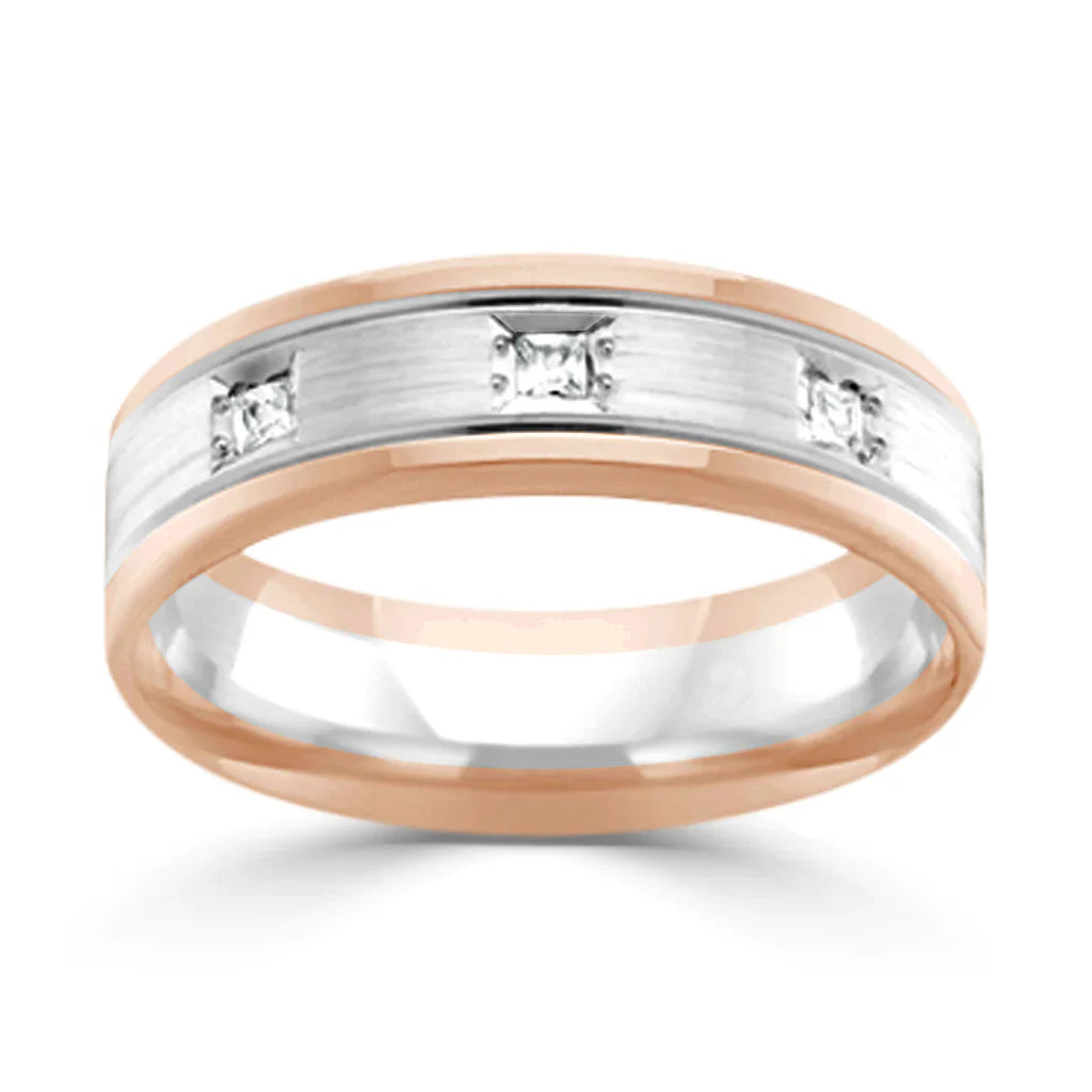 A two-tone men’s ring with three square diamonds set in a brushed silver center and rose gold edges.