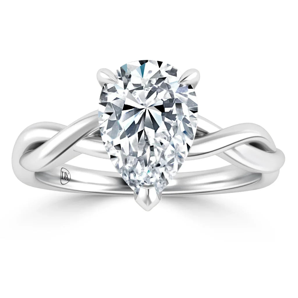 Pear-shaped diamond ring with a twisted white gold band on a white background.