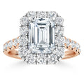An emerald-cut diamond ring with a halo and band of round diamonds set in rose gold.