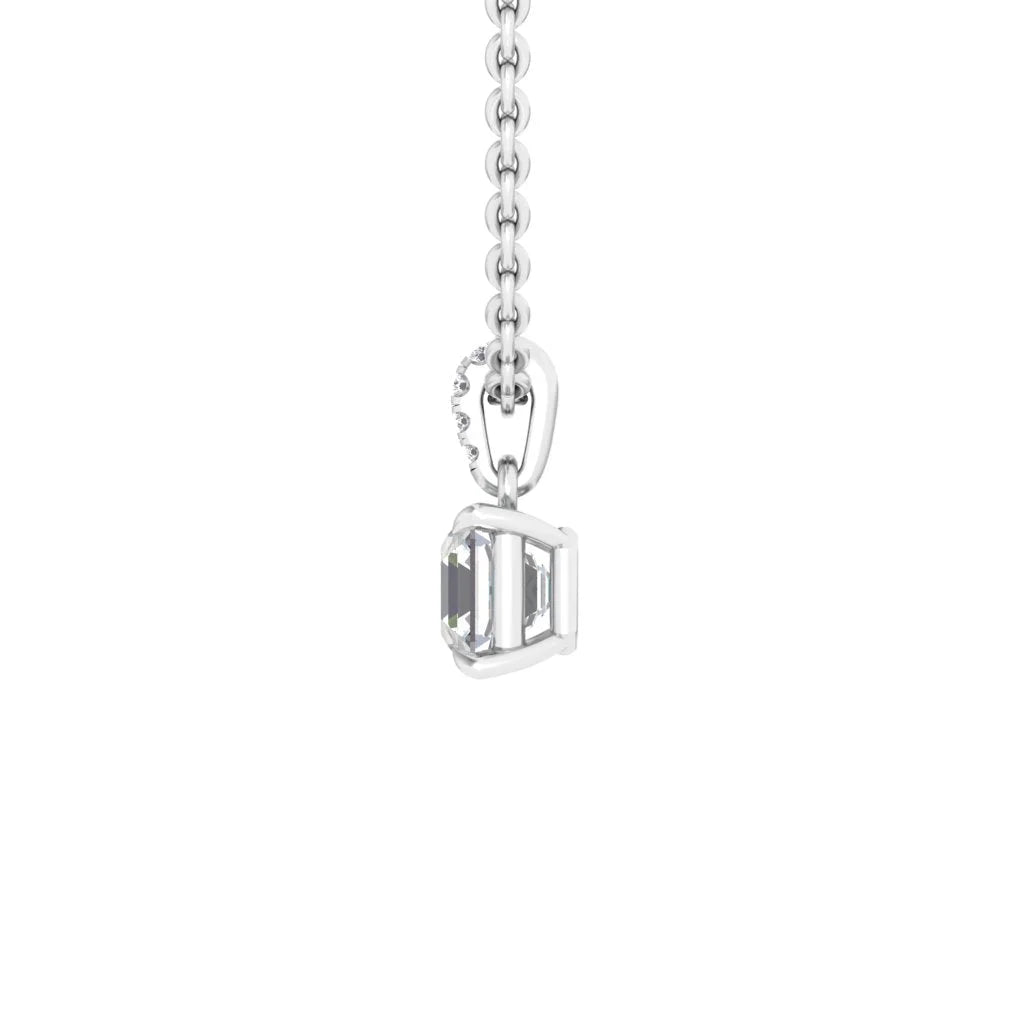 Close-up of a silver chain with a rectangular, clear gemstone pendant in a simple prong setting.