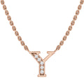 Rose gold necklace with a Y-shaped pendant, adorned with small white diamonds on one side.