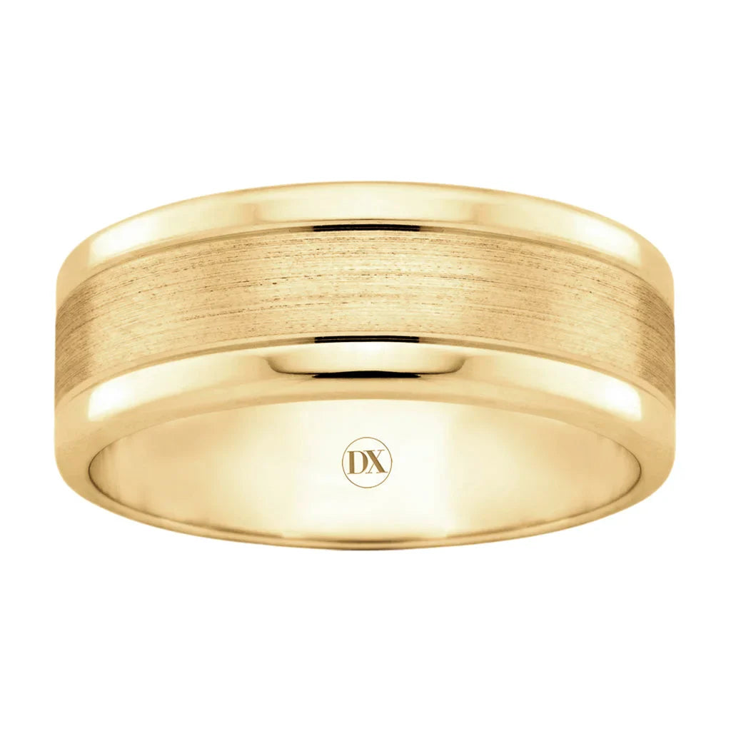 Wide gold ring with a brushed matte center and polished edges, featuring a small DX engraving inside.