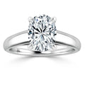 Oval-cut diamond solitaire ring with a shiny, plain white metal band and four-prong setting, on white background.