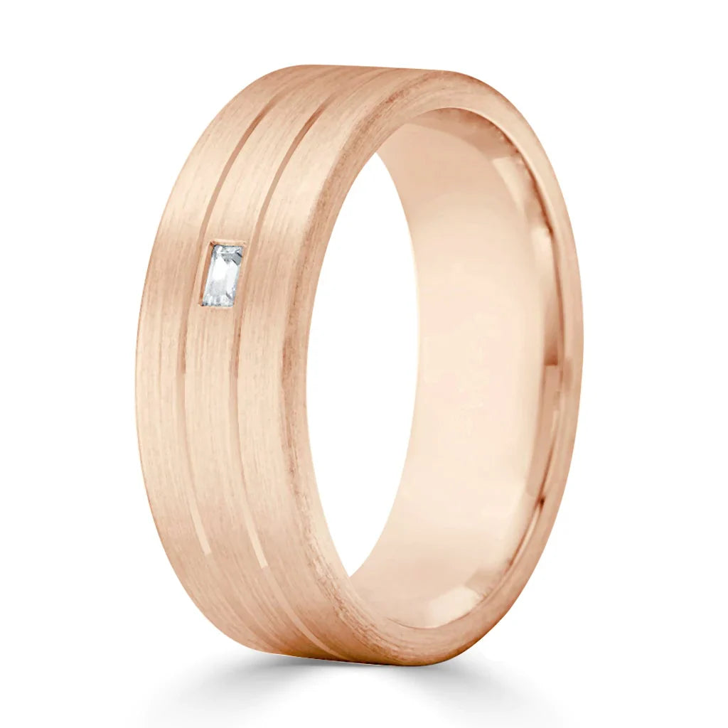 Rose gold ring with a small rectangular diamond and two parallel grooves on a matte finish band.