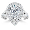 Pear-shaped diamond ring with double halo and split shank, all set in white gold and encrusted with small diamonds.
