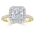 Square-cut diamond ring with a halo of smaller diamonds on a yellow gold band, viewed from the front.