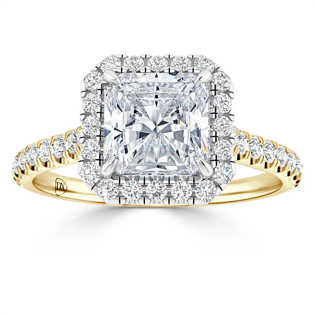 Square-cut diamond ring with a halo of smaller diamonds on a yellow gold band, viewed from the front.