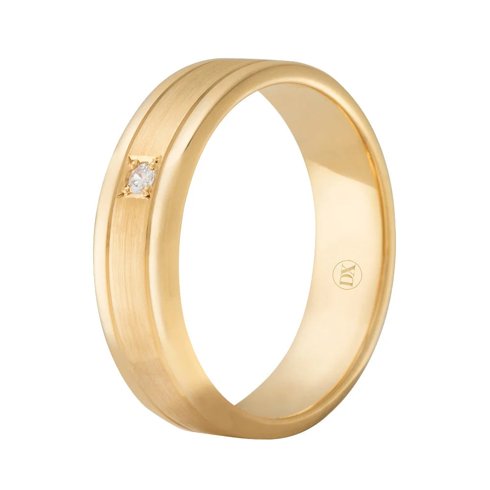 Gold ring with a small inset diamond and a brushed matte finish, featuring an engraved logo inside the band.