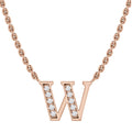 Rose gold necklace with a “W” pendant, half encrusted with small, sparkling clear gemstones.