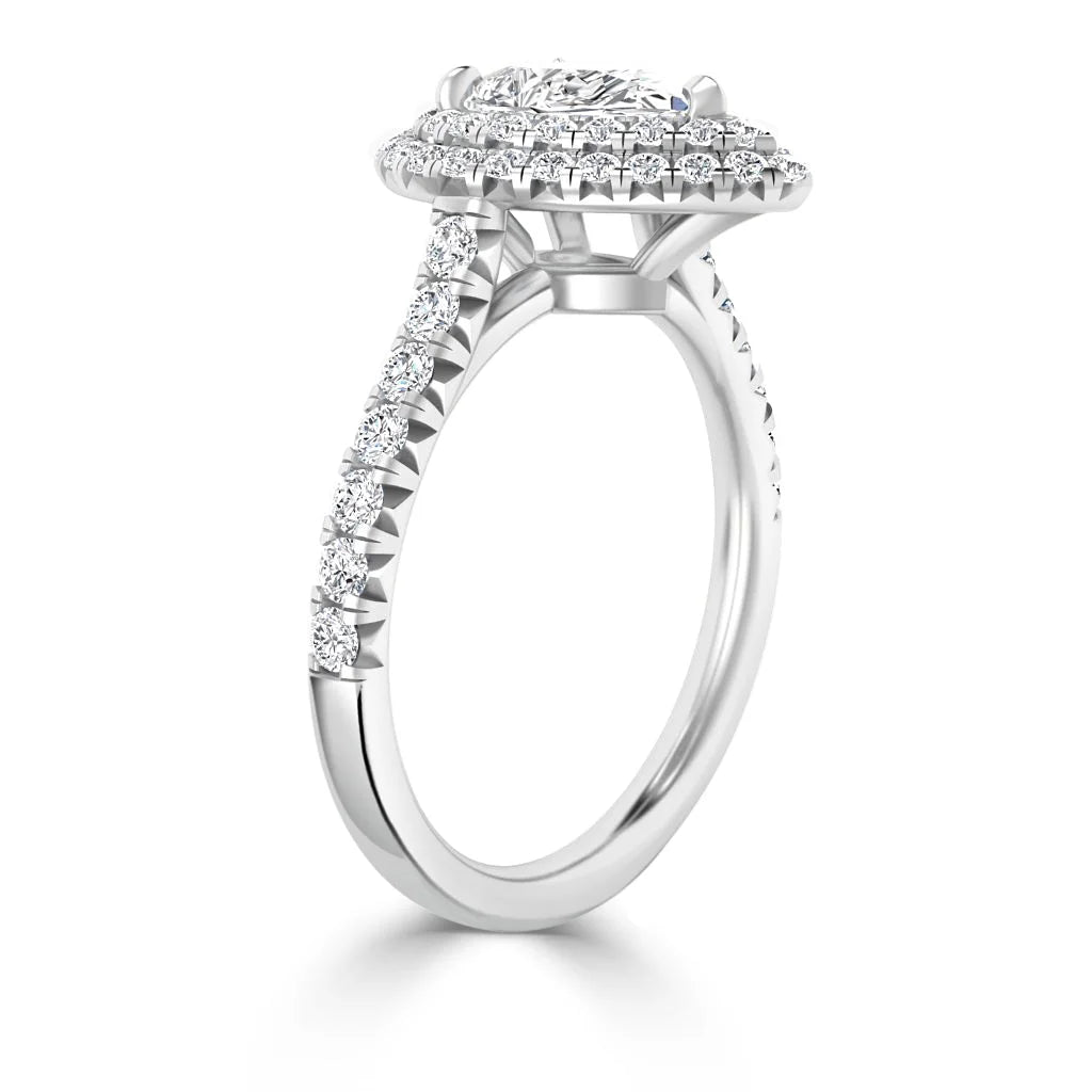 White gold ring with a round halo of diamonds and a diamond-encrusted band, shown from a side angle.