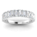 Platinum ring with a row of emerald-cut diamonds set closely together along the band.