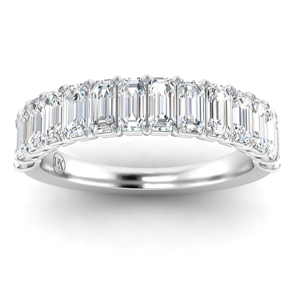Platinum ring with a row of emerald-cut diamonds set closely together along the band.