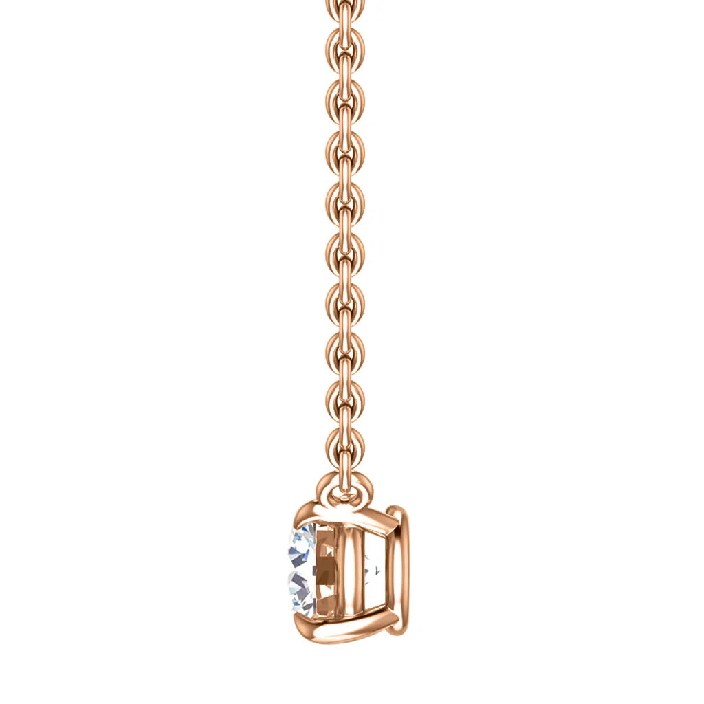 Rose gold chain necklace with a single round clear gemstone in a four-prong setting, shown on a white background.