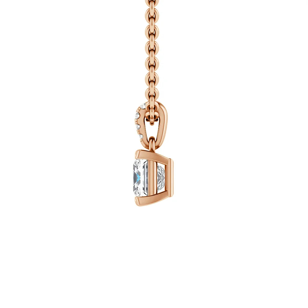 Rose gold chain with a rectangular gemstone pendant, accented by small diamonds along the pendant’s bail.