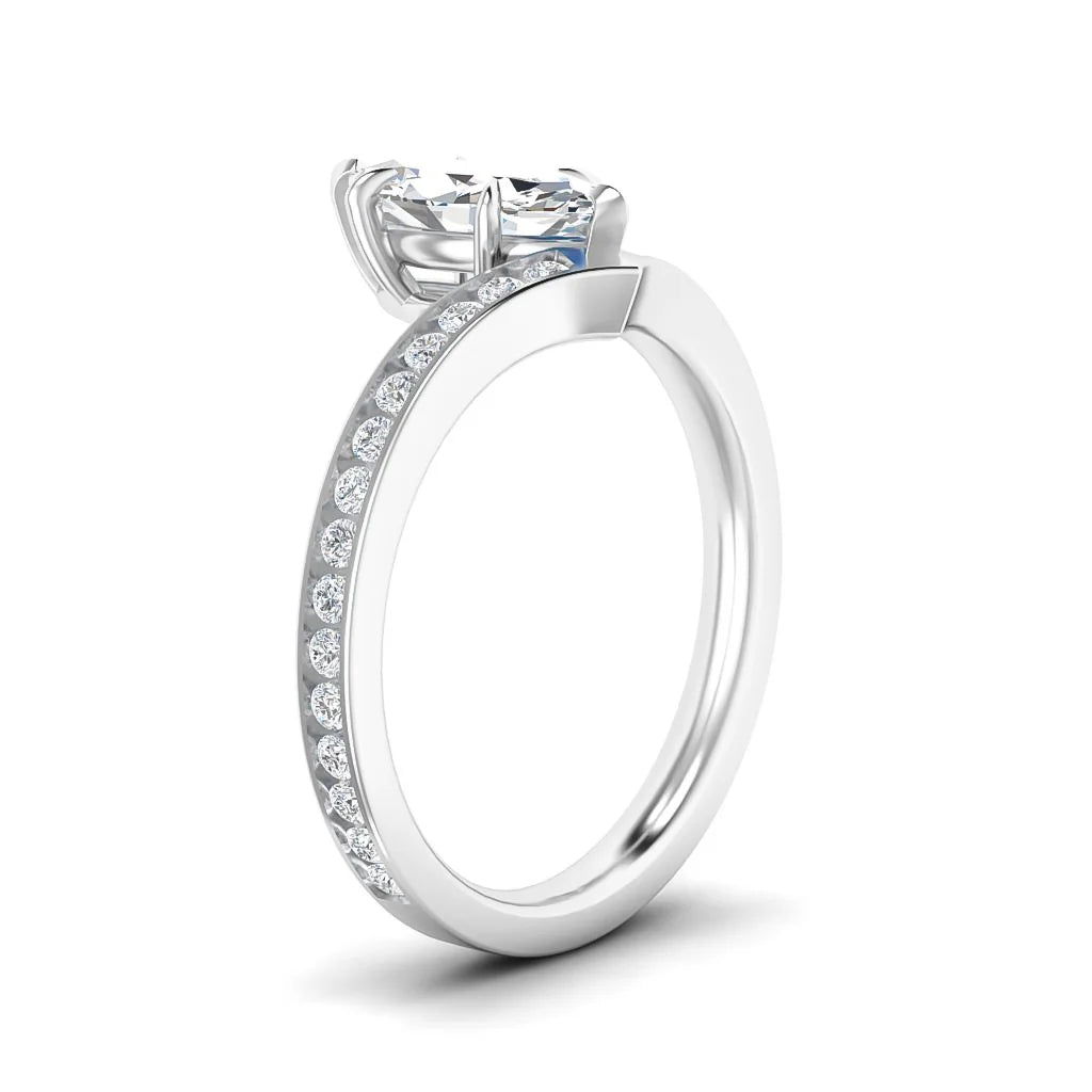 A silver ring with a large round diamond center stone and smaller diamonds along the band, shown on a white background.