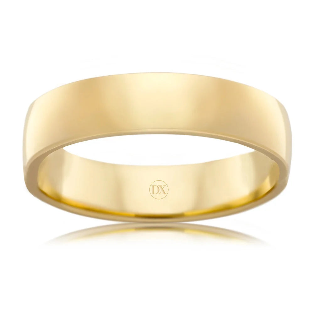 A plain, polished yellow gold wedding band with a smooth, flat surface and a subtle DX engraving inside.