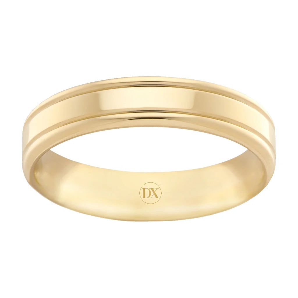 A simple, polished yellow gold ring with a subtle groove and engraved DX inside the band.